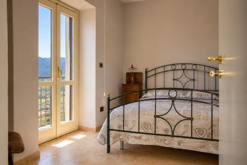 Rúm í herbergi á Vista D'incanto