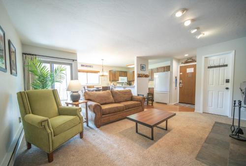 a living room with a couch and chairs and a table at Flying Dutchman 1115 by SummitCove Lodging in Colorado in Keystone