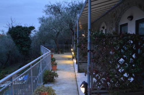 a house with a fence with plants on it at Affittacamere arabafenice in Vezzano Ligure