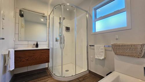 a bathroom with a shower and a sink at "Great Scott" Great spot your Tekapo Retreat in Lake Tekapo