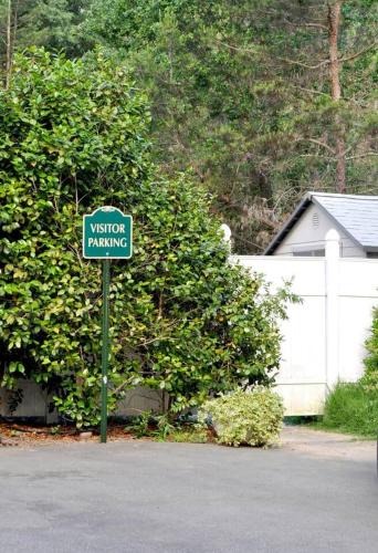 a visitor parking sign in front of a house at Luxury Private Poolside Suite in Napa