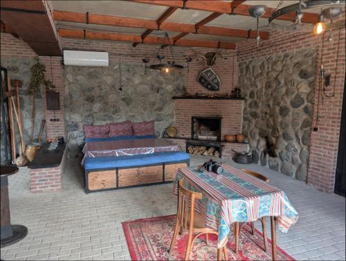 a living room with a couch and a fireplace at Your home, Lagodekhi in Lagodekhi
