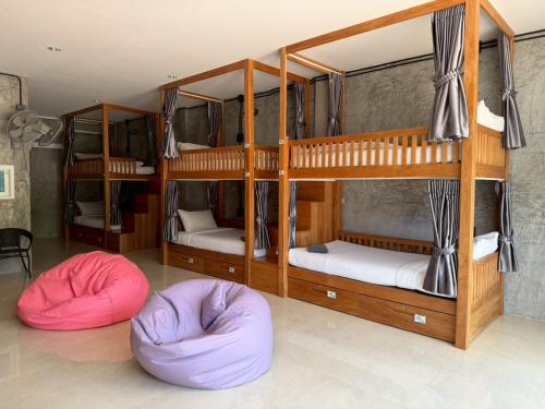 two bunk beds with bean bags in a room at Friendlyhostel in Khao Sok National Park