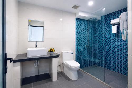 a bathroom with a toilet and a sink and a shower at Cloud House Sapa in Sapa