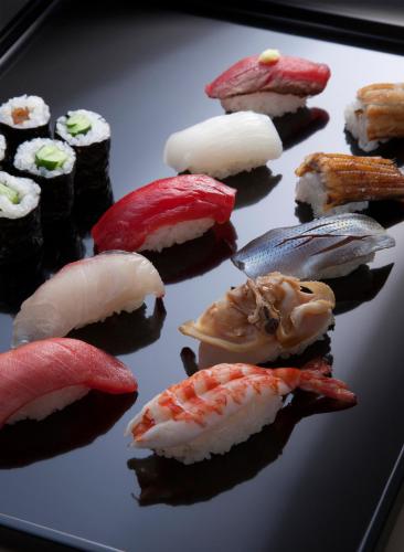 a bunch of sushi sitting on a plate at Imperial Hotel Osaka in Osaka