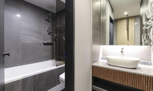 a bathroom with a sink and a toilet at Wonju Brown Dot Hotel Corporate city in Wonju