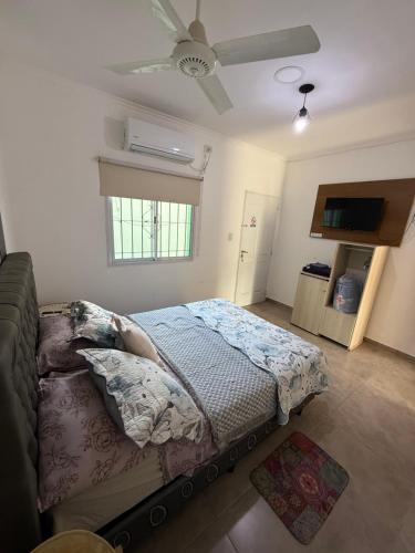 a bedroom with a bed and a ceiling fan at Josefina l in Goya