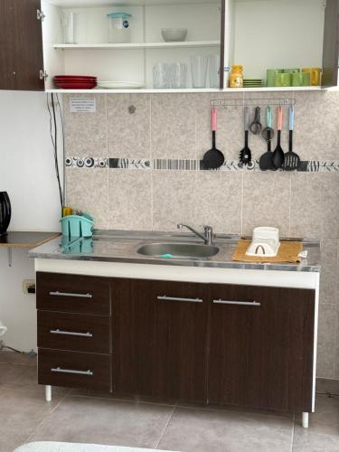 a kitchen with a sink and a counter top at Josefina l in Goya