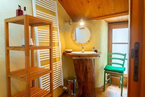 a bathroom with a sink and a mirror at Ecogîte nature de bieisses in Quézac
