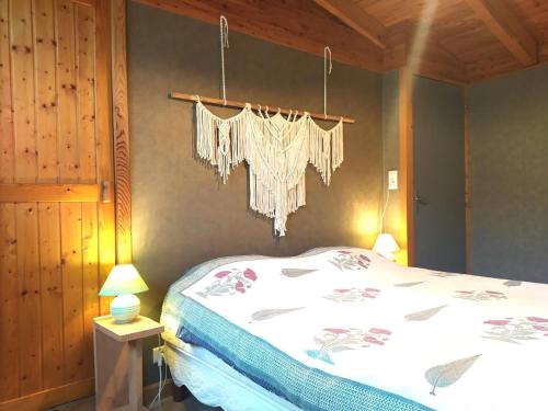 a bedroom with a bed with a white comforter at La drosera in Lajo