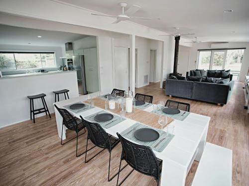 a living room with a white table and chairs at Lonsdale on Glaneuse in Point Lonsdale