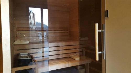 a room with a sauna with a window at Appartements Bétemps in Le Grand-Bornand