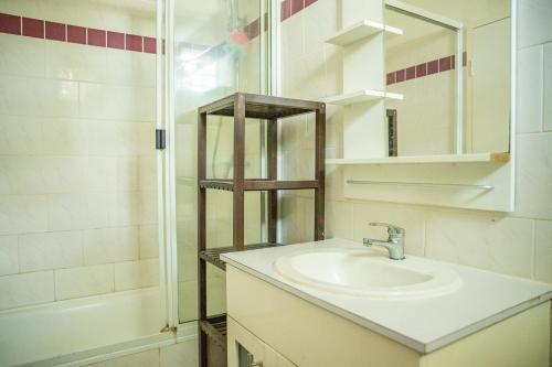 a bathroom with a sink and a shower at seaview apartment in Honiara