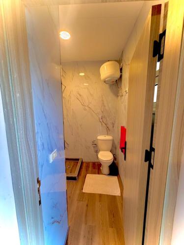 a bathroom with a toilet in a room at Hurghada Porto View in Hurghada