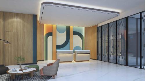 a lobby with a couch and a table and chairs at Swiss-Belexpress K Square Batam in Batam Center