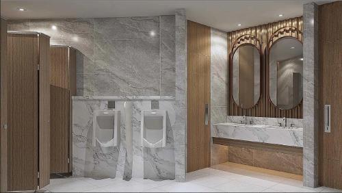 a bathroom with two sinks and two urinals and mirrors at Swiss-Belexpress K Square Batam in Batam Center