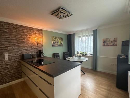 a kitchen with a sink and a counter top at Ferienwohnung Zum Gartenparadies in Oppach
