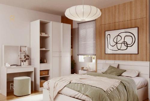 a bedroom with a bed and a chandelier at 50 m by BTS Taladplu in Thonhuri