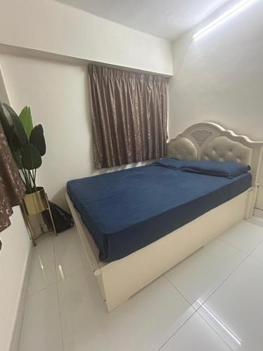 a bedroom with a bed with a blue mattress at 2 bhk flat available in tst in Hong Kong