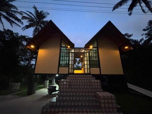 a building with a bunch of stairs in front of it at Casa Kabani Resort in Chegāt