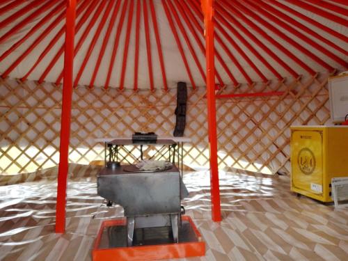 a large tent with a table in the middle at Mongolian traditional Ger accomodation in Narst