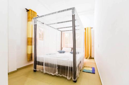 Ένα ή περισσότερα κρεβάτια σε δωμάτιο στο Cocoplant Surf Inn