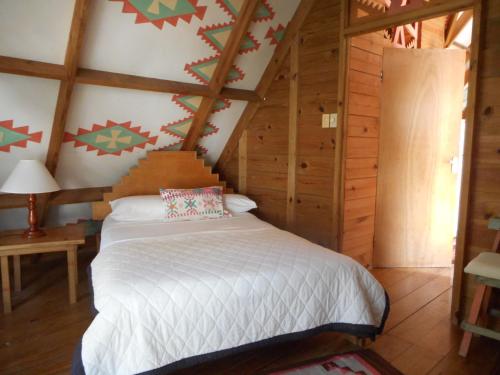 Una cama o camas en una habitación de Chippewa Village