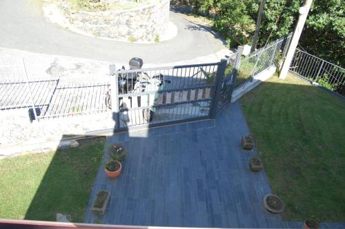 an aerial view of a porch with a fence and plants at Villa Giuanne in Arenzano