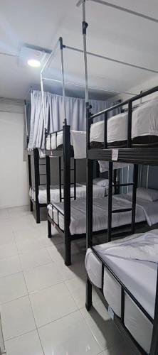 a group of bunk beds in a room at Hana hostel in Labuan Bajo