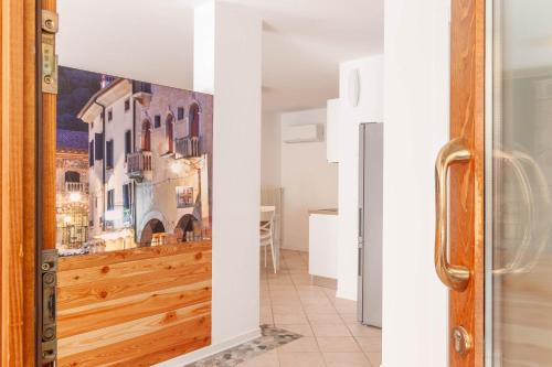 a room with a door with a painting on the wall at Alle Porte in Vittorio Veneto