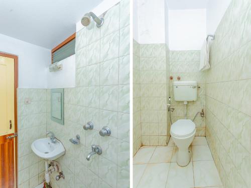 a bathroom with a toilet and a sink at Tokyo Hotel in Kathmandu