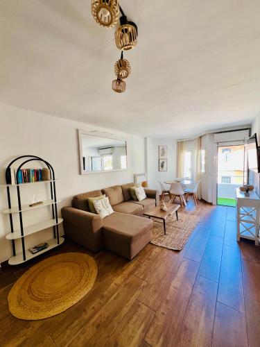 a living room with a couch and a table at Puerto de Pollença - Beach and Center,Happy Mar in Port de Pollensa