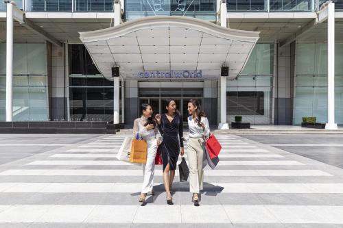 three women walking in front of a shopping center at Courtyard by Marriott Bangkok in Bangkok