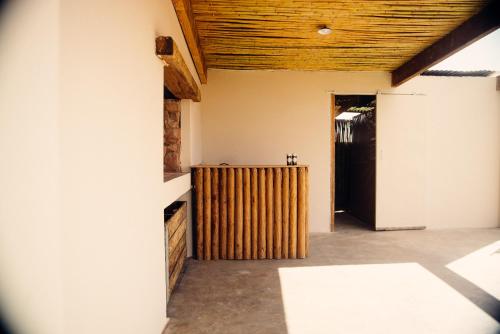 an empty room with a wooden ceiling at Nama-Qua Game Reserve in Vredendal