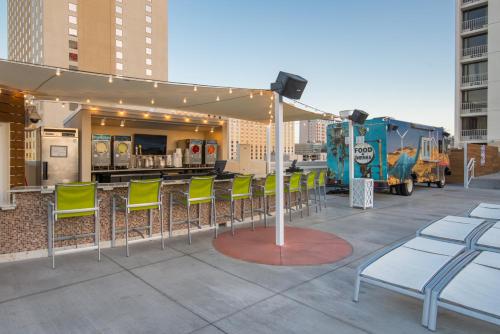 a group of chairs on a patio with a food truck at Plaza Hotel & Casino in Las Vegas
