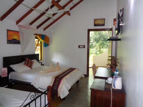 Posteľ alebo postele v izbe v ubytovaní Rimaka Village Tourist Board Approved