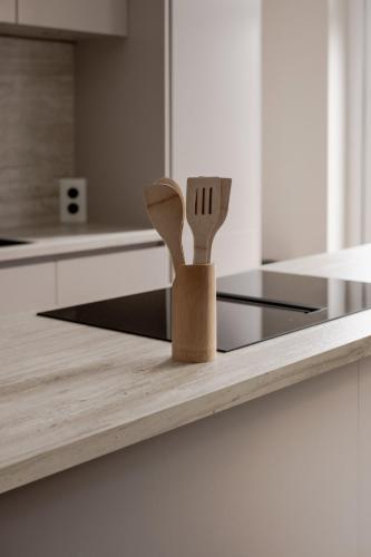 a knife and fork holder on a counter in a kitchen at Spacious family home in Schiedam