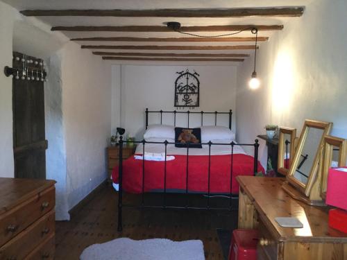 a bedroom with a red bed in a room at Cycle to the Zipwire in Bethesda