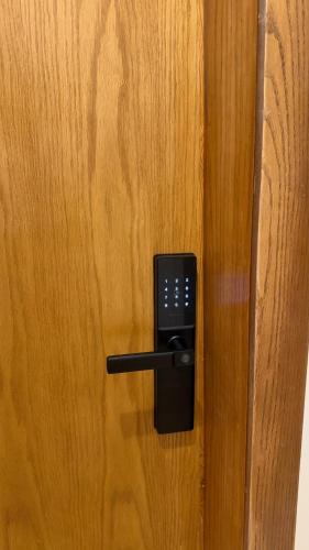 a door with a cell phone sticking out of it at Apartment in Al Kharj