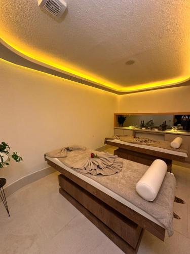 a room with a bed and a mirror at Derici Hotel in Kuşadası