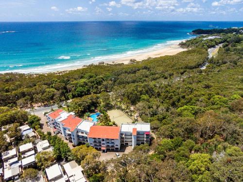 an aerial view of a resort and the beach at The Islander in Point Lookout