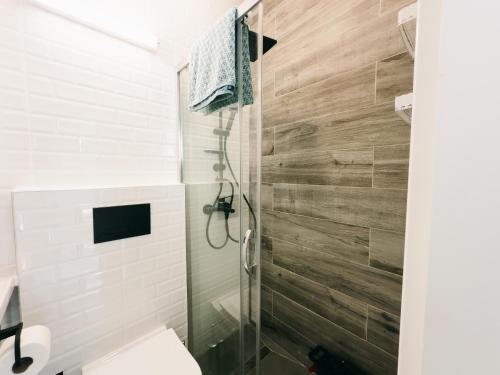 a bathroom with a toilet and a glass shower at Luxury 2 Bedroom Apartment in Caesar Resort in Iskele