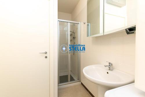 a bathroom with a shower and a sink at Condominio Mimose in Eraclea Mare