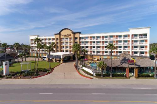 a view of a hotel from the street at DoubleTree by Hilton Galveston Beach in Galveston