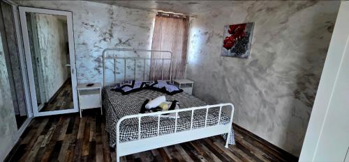 a bedroom with a white bed in a room at Lazy Lounge Apartments & Rooms in Mangalia