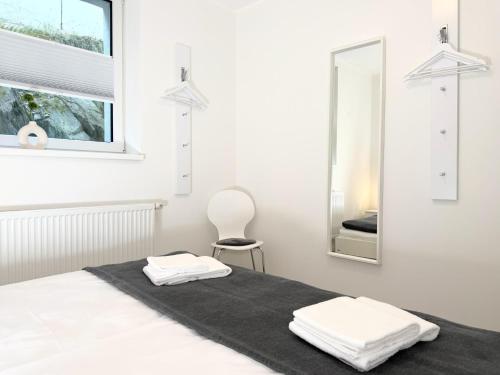a bedroom with a bed with two towels on it at Fewo Diemelsee 2 in Heringhausen