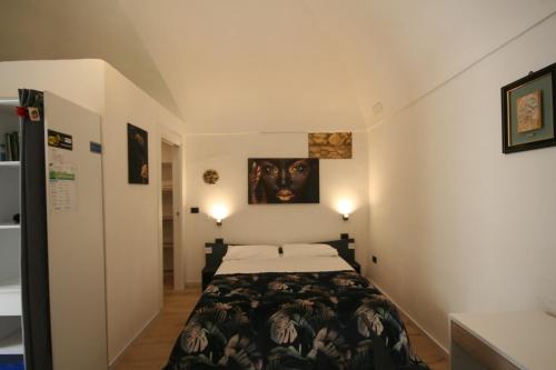 a bedroom with a bed in a small room at Spago rooms 2 in Vieste