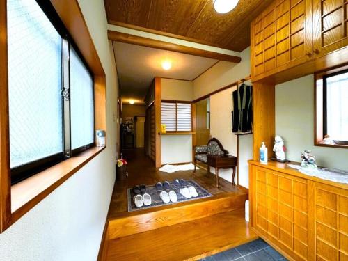 a living room with a large window in a room at 伊東旅館 禅- Zen - in Ito