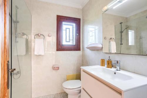 a bathroom with a sink and a toilet and a shower at Villa Bauza by Villa Plus in El Port