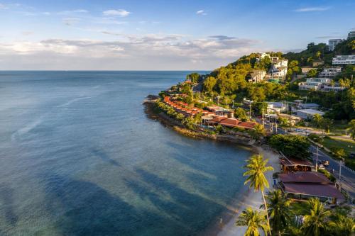 an aerial view of a resort on the ocean at The Sarann Koh Samui, Suites & Villas in Chaweng Noi Beach